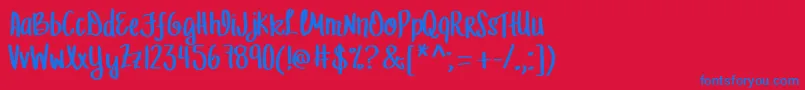 MrfLetFreedomRing-Schriftart – Blaue Schriften auf rotem Hintergrund
