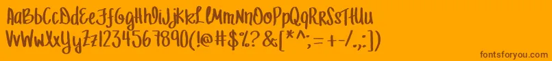 MrfLetFreedomRing-Schriftart – Braune Schriften auf orangefarbenem Hintergrund