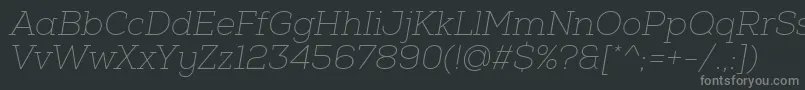 NexaSlabThinOblique-fontti – harmaat kirjasimet mustalla taustalla