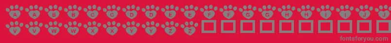 フォントJlrPawrtyHearty – 赤い背景に灰色の文字