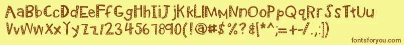フォントKbradiowizard – 茶色の文字が黄色の背景にあります。