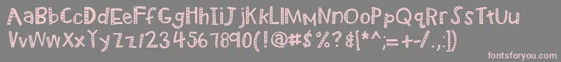 フォントKbradiowizard – 灰色の背景にピンクのフォント