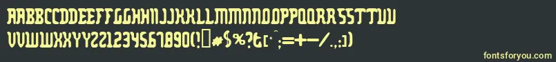 フォントZodillinstrisstirust – 黒い背景に黄色の文字