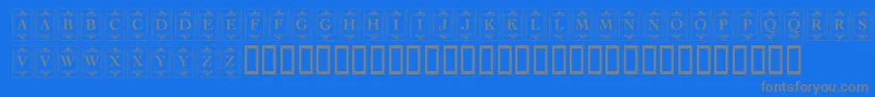 KrDecoCapsOne-fontti – harmaat kirjasimet sinisellä taustalla