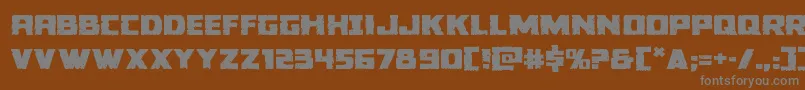 Colossusexpand-fontti – harmaat kirjasimet ruskealla taustalla