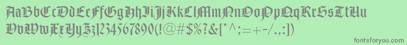 フォントNotreDameLtRoman – 緑の背景に灰色の文字