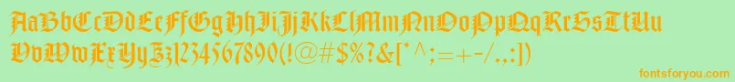 フォントNotreDameLtRoman – オレンジの文字が緑の背景にあります。