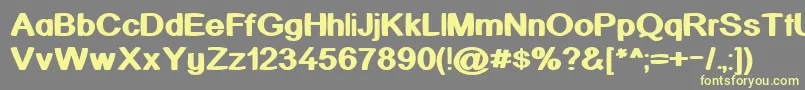 KickAssinger Font – Yellow Fonts on Gray Background