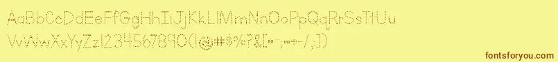 LettersForLearnersDotsHattedJ-fontti – ruskeat fontit keltaisella taustalla