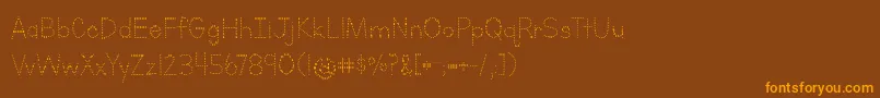 フォントLettersForLearnersDotsHattedJ – オレンジ色の文字が茶色の背景にあります。