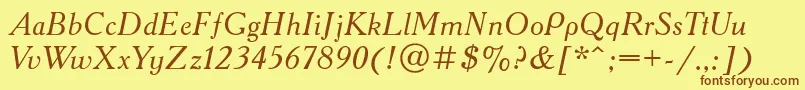 フォントAcademyacttItalic – 茶色の文字が黄色の背景にあります。