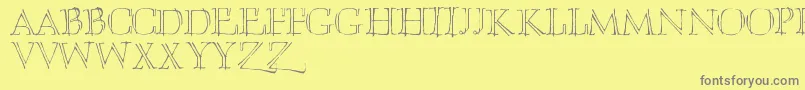 Umberette-Schriftart – Graue Schriften auf gelbem Hintergrund