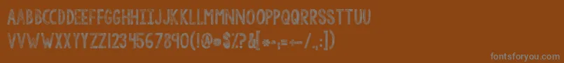 Kgtangledupinyou Font – Gray Fonts on Brown Background