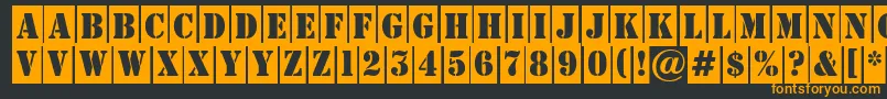 フォントAStampercm – 黒い背景にオレンジの文字