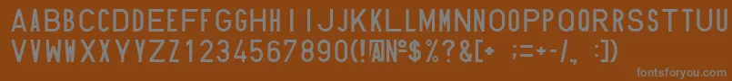 フォントHundin1451 – 茶色の背景に灰色の文字