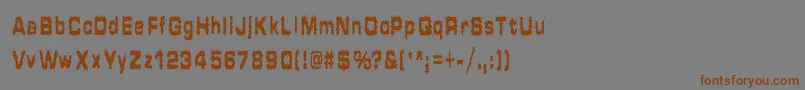 フォントHammeredType – 茶色の文字が灰色の背景にあります。