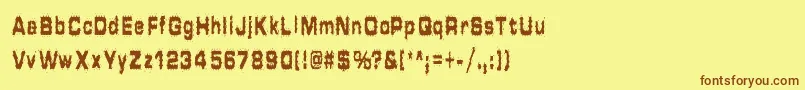 フォントHammeredType – 茶色の文字が黄色の背景にあります。