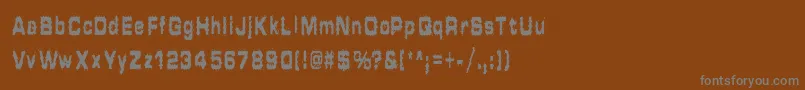 HammeredType-fontti – harmaat kirjasimet ruskealla taustalla