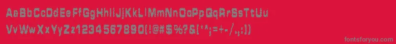 HammeredType-fontti – harmaat kirjasimet punaisella taustalla