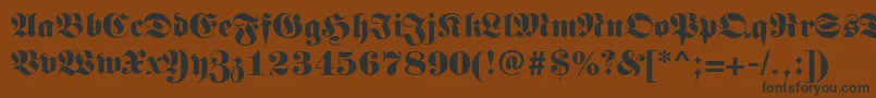 Germanregular-fontti – mustat fontit ruskealla taustalla