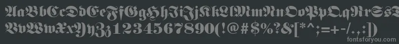 Germanregular-fontti – harmaat kirjasimet mustalla taustalla