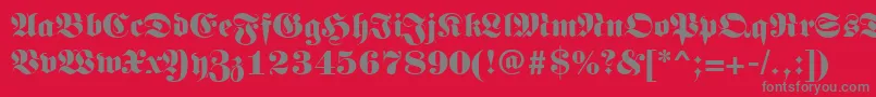 Germanregular-fontti – harmaat kirjasimet punaisella taustalla