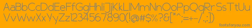 Compasslight-fontti – harmaat kirjasimet oranssilla taustalla