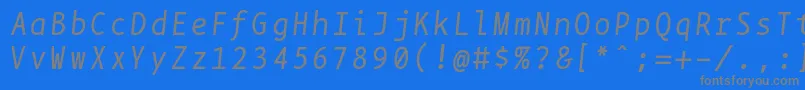 Czcionka Bpmonoitalics – szare czcionki na niebieskim tle