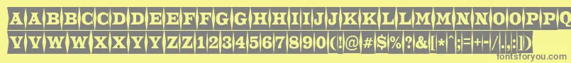 ATrianglercmfld-fontti – harmaat kirjasimet keltaisella taustalla