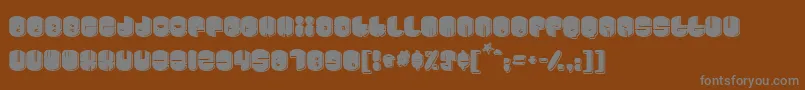 Cosmojun-fontti – harmaat kirjasimet ruskealla taustalla
