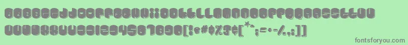 Cosmojun-fontti – harmaat kirjasimet vihreällä taustalla