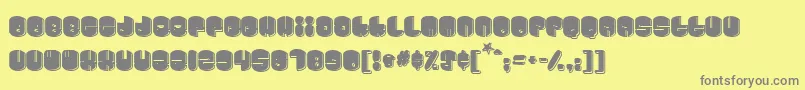 Cosmojun-fontti – harmaat kirjasimet keltaisella taustalla