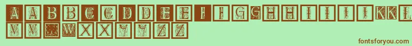 フォントDelitzschcaps – 緑の背景に茶色のフォント