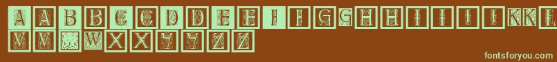 フォントDelitzschcaps – 緑色の文字が茶色の背景にあります。