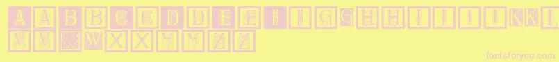 Delitzschcaps-Schriftart – Rosa Schriften auf gelbem Hintergrund