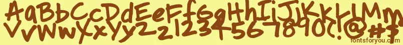 フォントUpcycledmama – 茶色の文字が黄色の背景にあります。