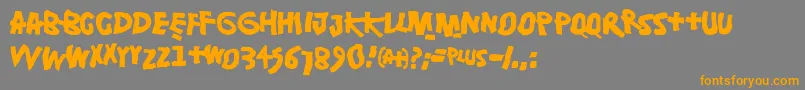 フォントDamsterdam – オレンジの文字は灰色の背景にあります。