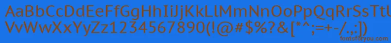 フォントPtc55f – 茶色の文字が青い背景にあります。