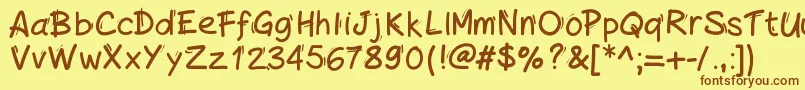 フォントHandylinedfont – 茶色の文字が黄色の背景にあります。