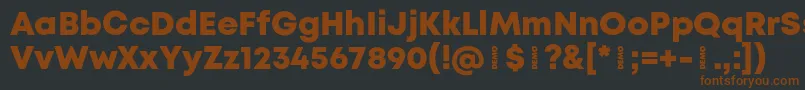 Шрифт MontHeavydemo – коричневые шрифты на чёрном фоне