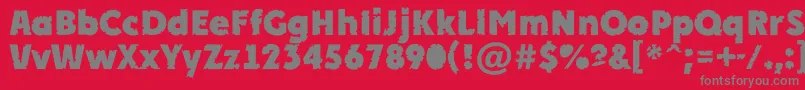 Fonte APlakatcmplrrbtExtrabold – fontes cinzas em um fundo vermelho
