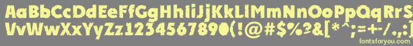 APlakatcmplrrbtExtrabold-Schriftart – Gelbe Schriften auf grauem Hintergrund