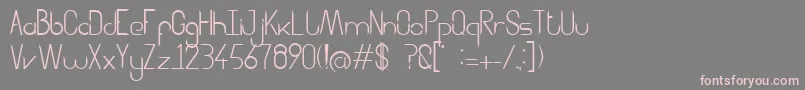 Aggressor Font – Pink Fonts on Gray Background