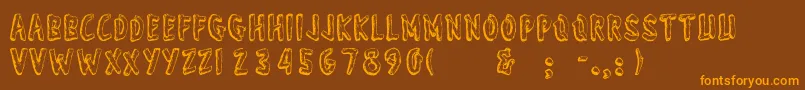 フォントWonderofyosemite – オレンジ色の文字が茶色の背景にあります。
