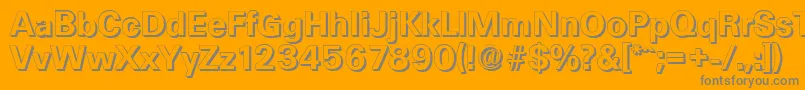 UltimateshadowBold-fontti – harmaat kirjasimet oranssilla taustalla