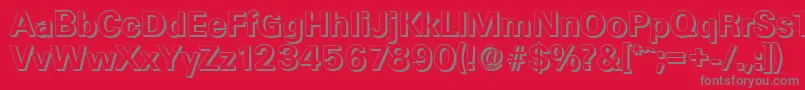 UltimateshadowBold-fontti – harmaat kirjasimet punaisella taustalla