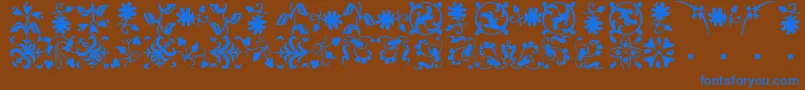 BorderbatsFleurRegular-fontti – siniset fontit ruskealla taustalla