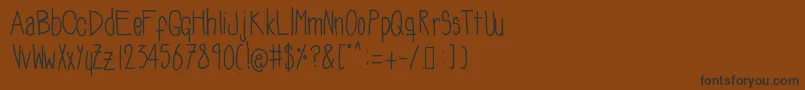 Soozieqs Font – Black Fonts on Brown Background