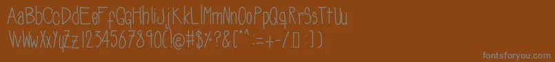 Soozieqs Font – Gray Fonts on Brown Background