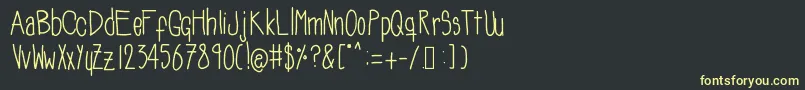 Soozieqs Font – Yellow Fonts on Black Background